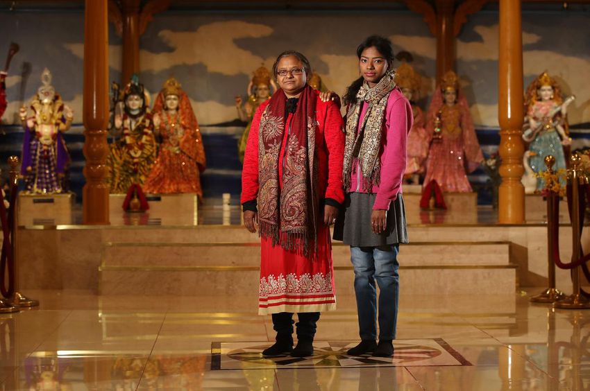 Popi Rani Das, with her mother, Ajanta Rani Das, who hasn't left her daughter's side since the attack that left her unable to eat or drink.